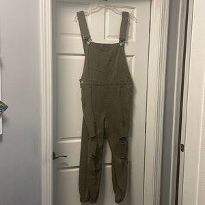 Kittenish army green overalls. Distressed